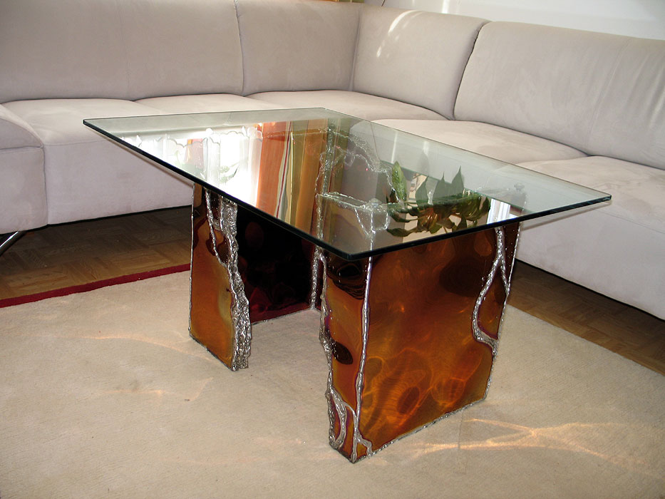 Designer table in red stainless steel